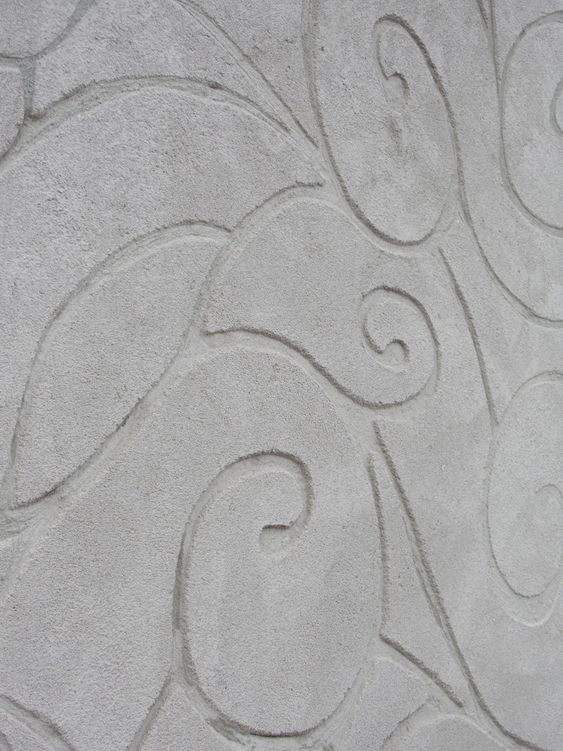 Motif grattÃ© sur un enduit Ã  la chaux.